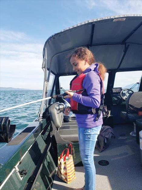 Bridgett Reed, of Kalispell, fishes during the tournament.