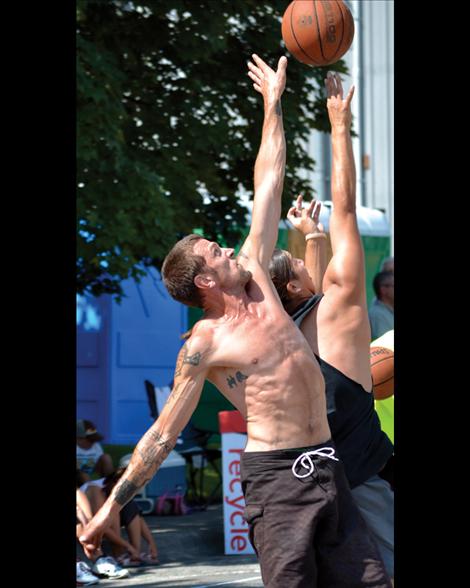 Sean Hayward of the Flying Guillotines battles the Outlaws' J.J. Tanner of Ronan in Saturday’s round one of the Flathead Lake 3 on 3.