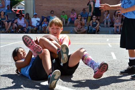 Morning Stars’ Kooper Page, left, wrestles Miami Sunshine’s Megan Rost for possession of the ball.