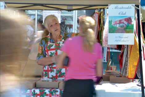Montecahto members Marlene Mimms, left, and Myrna Ducharme sell cherry pies at the Polson Main Street Flathead Cherry Festival on July 20.