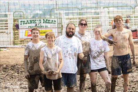 The 2021 Bump, Set, Splat! Mud Volleyball Tournament champions “That’s What She Set” pose for a team photo.