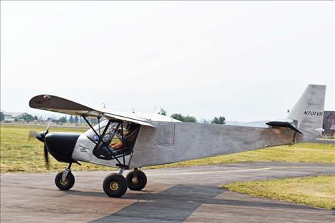 Aircraft land at the airport during the Good Old Days Fly-In Sunday morning. 