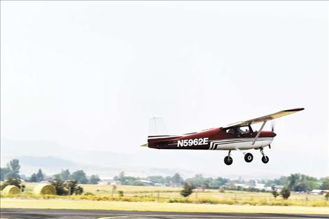 Aircraft land at the airport during the Good Old Days Fly-In Sunday morning.