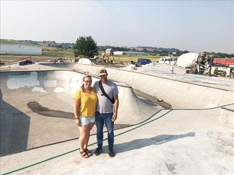 Loni Havlovick and Jesse Vargas stand on the north edge of Polson Skatepark as the Dreamland Skatepark crew completes the most recent addition, just in time for this Saturday’s Skate Jam. 
