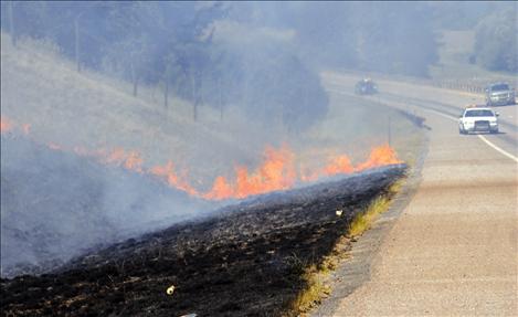 Polson volunteer firefighters responded to a report of a grass fire on Polson Hill Friday afternoon, and quickly doused the flames spreading through dry grass.