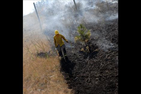 Polson volunteer firefighters responded to a report of a grass fire on Polson Hill Friday afternoon, and quickly doused the flames spreading through dry grass.