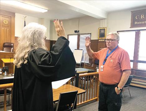 Lake County’s new commissioner, Steve Stanley, was sworn in by District Court Judge Kim Christopher last Thursday, July 29. He officially took office Aug. 1, replacing retiring commissioner Dave Stipe.