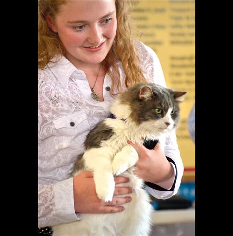 Ashley Shenyer shows her cat Macy, who was a gift on Ashley’s first birthday.