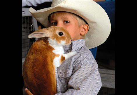 Koy McAllister holds Elmer, his Rex bunny. 
