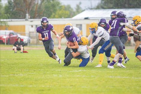 Charlo Viking Braydon Zempel drags a defender for a few extra yards.