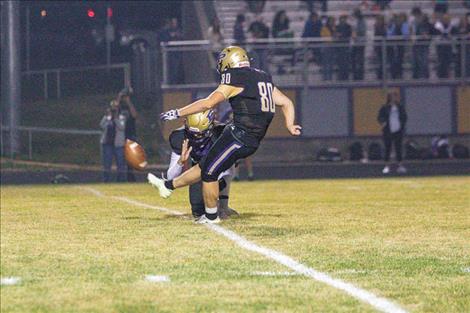 Polson Pirate kicker Nelson Kaden boots the ball through the uprights for an extra point.