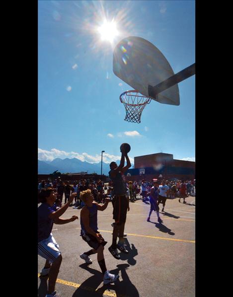 Teams battle Saturday at Ronan High School, where the Pioneer Days 3 on 3 drew 85 teams to the outdoor courts.