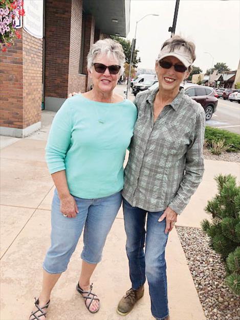 : Polson P.E.O. members Toni Young Whealon and Janice Donovan lead downtown Polson bumpout maintenance efforts.