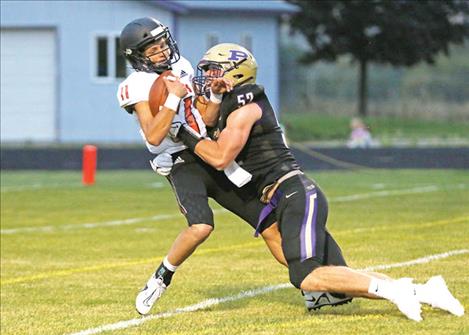 Polson Pirate Braunson Henriksen makes a tackle. 