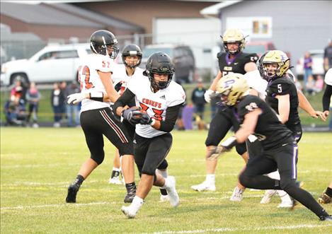 Ronan Chief running back Sage Coffman looks for some downfield running room.