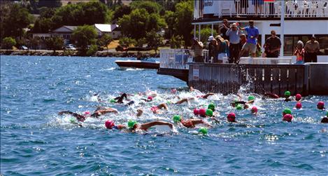 Swimmers churn up the water as the 11th annual Water Daze race begins. A breeze from the north made the water choppy, and that chop slowed down times.