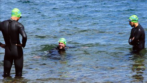 Three racers test the waters a few minutes befor the one-mile Water Daze swim begins.   