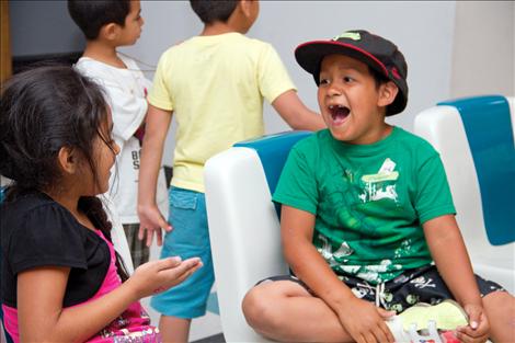  friendly game of hand slap keeps these youngsters entertained between bowling frames on Wednesday, July 31.