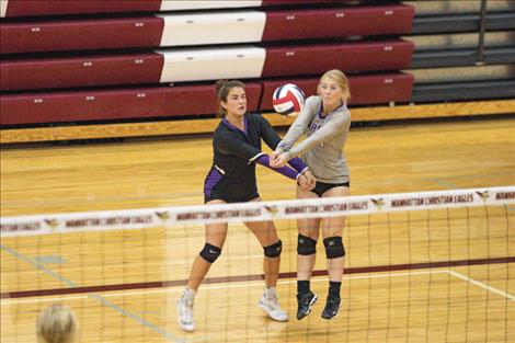 The Charlo Lady Vikings use teamwork to get the ball over the net.