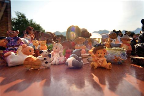 The morning sun rises over a table of ceramic bears waiting for buyers at Marie Cowen's 7,000-bear sale.