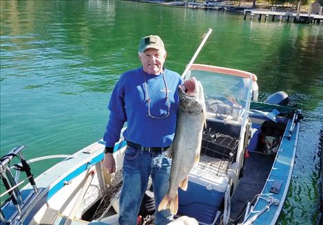Rick Skates holds up his 23.6 pound lake trout, the only entry so far in the largest lake trout categor