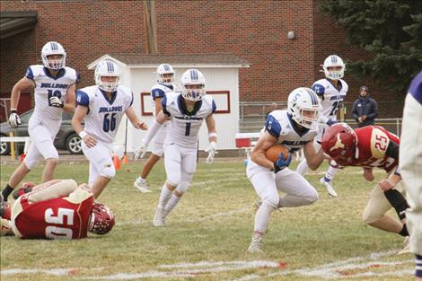 : Mission Bulldog Charley Adams prepares for a hit from a Long Horn defender.