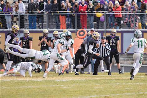 Pirate quarterback Jarrett Wilson  runs down the sideline  for a first down.