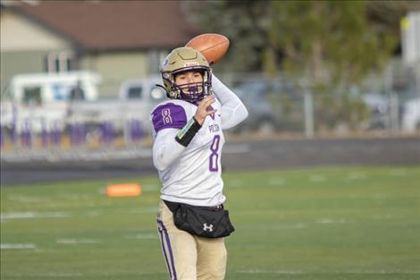 Polson Pirate quarterback Jarrett Wilson looks for an open Pirate receiver downfield.