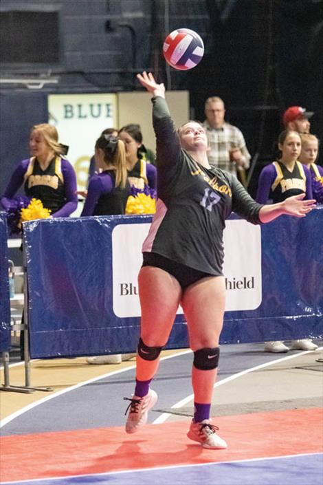 Polson Lady Pirate Avery Starr fires a serve over the net.