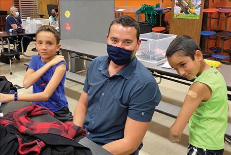 Myles and Vance Means attended last week’s COVID vaccination clinic at Linderman School in Polson with dad Chauncey. 