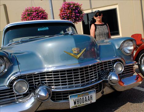 Judy Clark stands by her grandpa’s car. Judy’s grandpa, Hap Helm, bought the car new in 1954, and now she and her husband have it fixed up and on the road again. Clark also won best classic at the car show.  