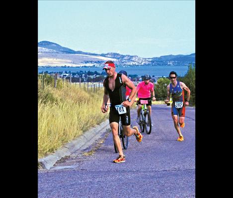 With a couple miles to go, Andy Drobeck of Missoula leads Polson’s Matt Seeley in the 6.2 mile run.