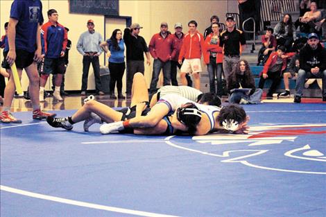 Mission Bulldog Kody Dillard pins his opponent.