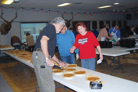 Volunteers work takeout and delivery meal preparation for Thanksgiving 2021.