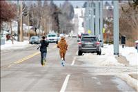 Runners slip, slide across half marathon finish line