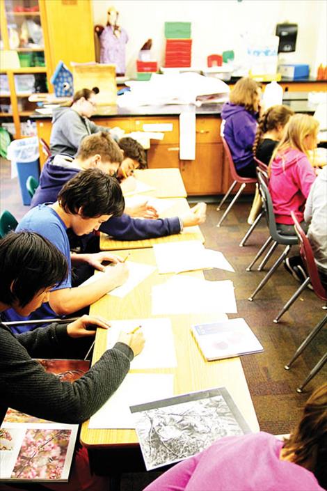 Students working on ledger art at St. Ignatius elementary school.