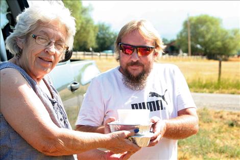 Patrick McGreevey delivers a meal to Edie Petty during his Meals on Wheels route.