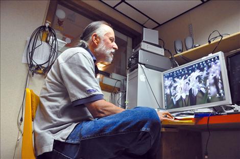 Surrounded by audio and editing equipment, Frank Tyro spends hours programming for Salish Kootenai College’s public television station KSKC. 