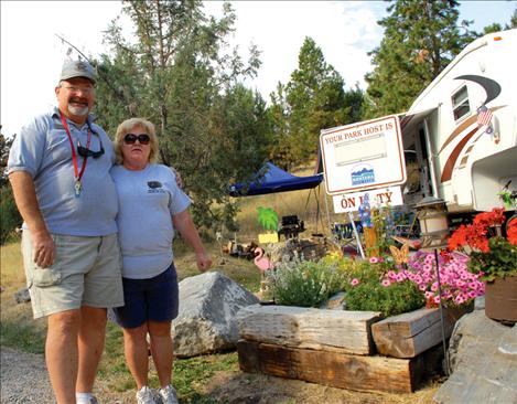 Dave and Judy Gray plant flowers for ”a touch of home.” The couple hails from Haughton, La., and they spent the summer at Big Arm State Park as a camp host and volunteer.