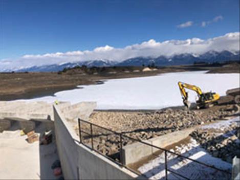 Work winds down on the upper spillway so that Crow Reservoir, which retains irrigation water for the Moiese Valley, can begin to fill again after 16 years of limited storage. 