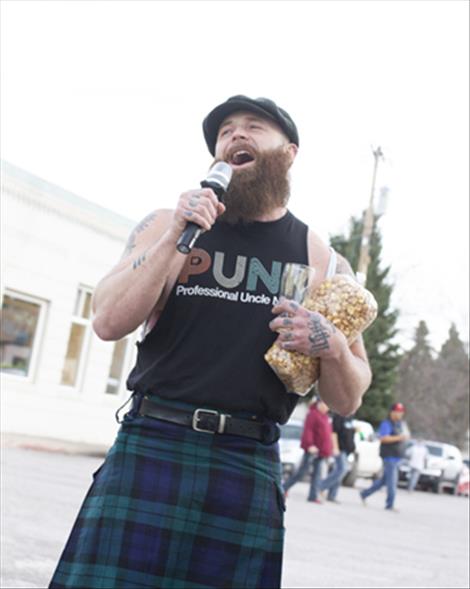 Ryan Allred sings an Irish karaoke ballad at the Ronan Coop Brewery after the parade.