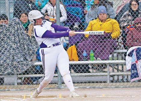 Polson Lady Pirtae Avery Starr launches a home run rocket during Thursday evening’s home game against the visiting Ronan Maidens.