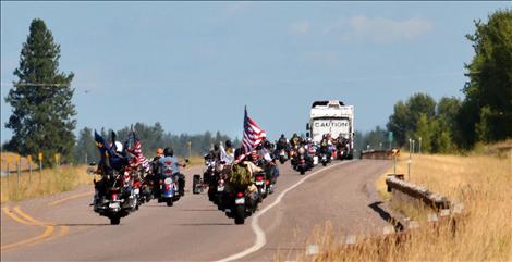 The wall headed north on Highway 93 toward Whitefish, surrounded by motorcyclists.