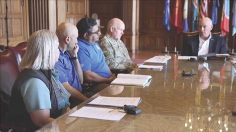 Gov. Gianforte receives a report from Theresa Hanley, Bureau of Land Management acting State Director for the Montana/Dakotas.