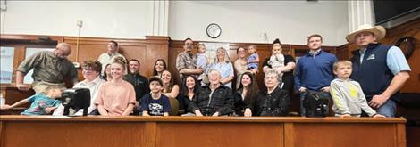 Wamsley’s family members who came to mark the occasion pose for a photo in the jury box.