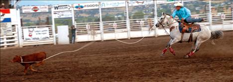 Pete White ropes a calf during the tie down roping in the INFR Flathead River Rodeo on Aug. 22. White competes in Northern Rodeo Association rodeos and INFR rodeos in this region.