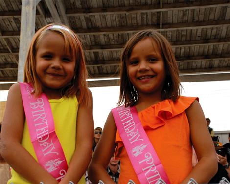 Birthday girls Alaina and Catherine enjoy the rodeo.