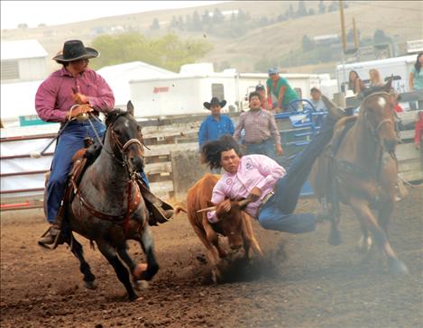 Otys LittleMustache steer wrestles.