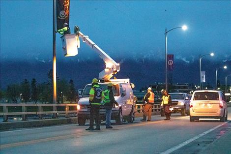 Raven Hall club members started installing flags on the Armed Forces Memorial Bridge at 4 a.m. on a Saturday.