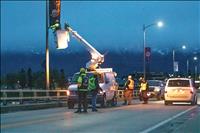 Raven Hall Motorcycle Riding Club installs flags on bridge